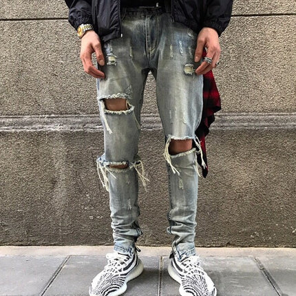 Washed holes in jeans, men and women GRE hip hop street trend stars with the same paragraph