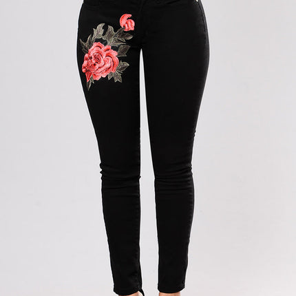 Black jeans with embroidered feet