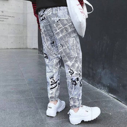 Tide brand hip hop newspaper pants men and women pants ins the same paragraph street loose beam pants national tide