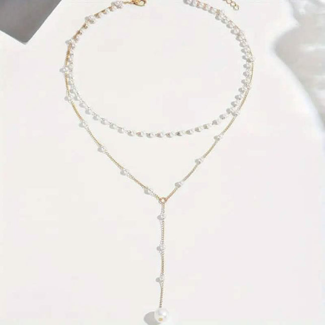 Elegant Vintage Style Double-Layer Pendant Necklace with Imitation Pearl Accents and Tassel Drop